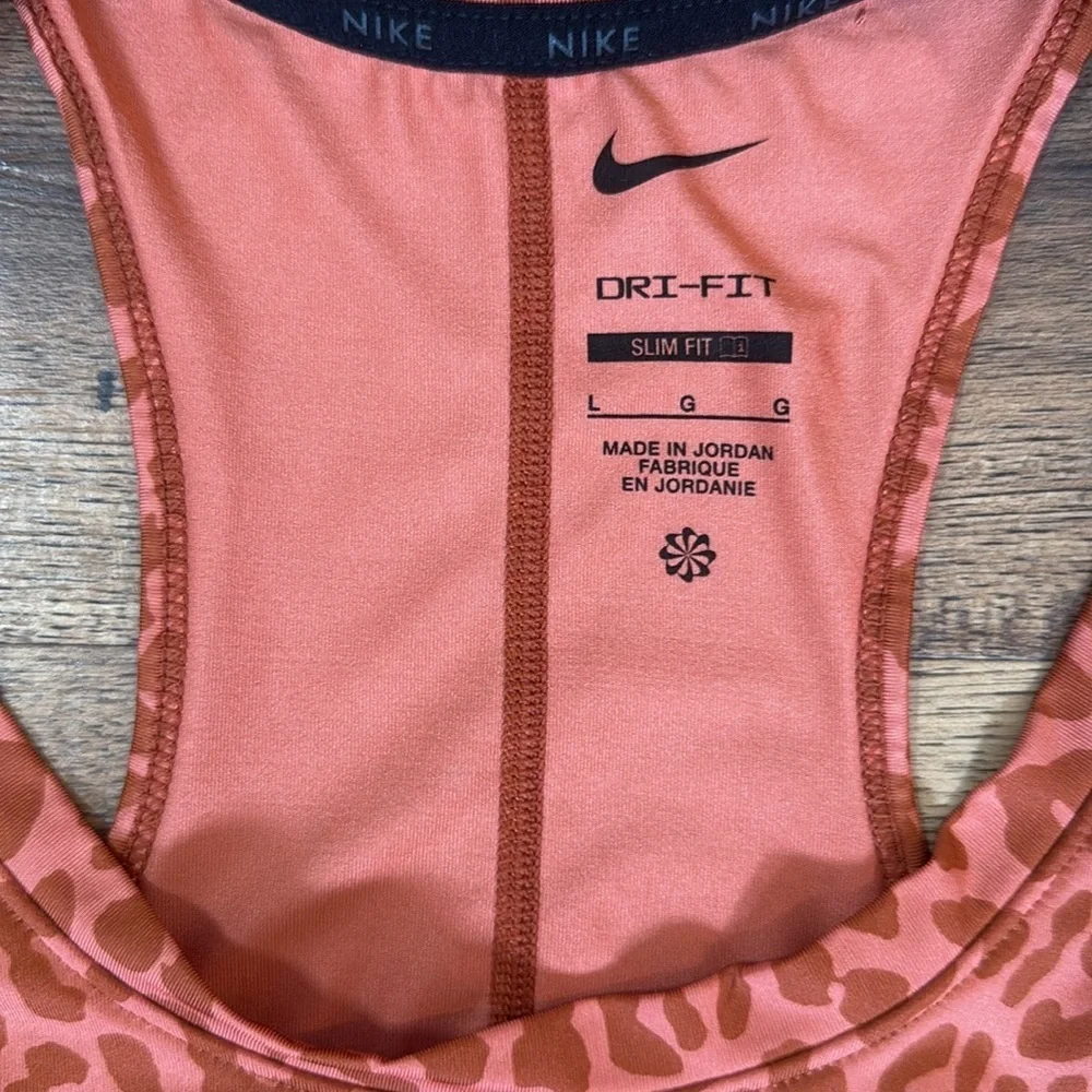 Nike Dri-FIT Slim Fit Tank Top in Orange